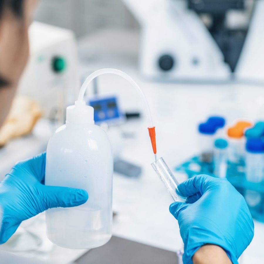 Soil Testing. Female Biologist Pouring Water Into Test Tube