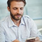 business-executive-using-mobile-phone (1)